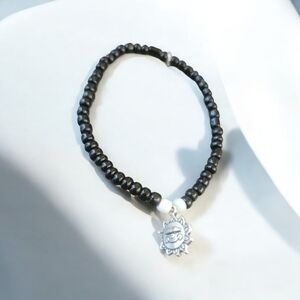 Black and White beaded bracelet with Sun charm saying Made with A Smile